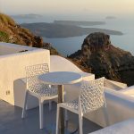 white table and chairs on top of the hill